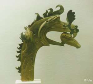Scythian deer's head in the beak of a griffin, Pazyryk.